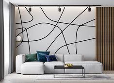 a living room with a white couch and black lines on the wall