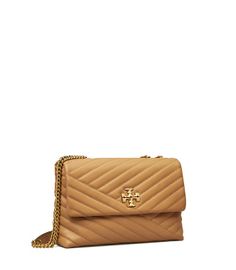 Directly from Tory Burch - The Kira Convertible Shoulder Bag is made of soft chevron-quilted leather with beveled Double T hardware. An adjustable chain strap adapts in the moment - doubled over the shoulder, or long and crossbody. Tory Burch Official Site. Kira Chevron Convertible Shoulder Bag, Tory Burch Kira Chevron, Kira Chevron, Tory Burch Kira, Leather Roll, Womens Designer Handbags, Designer Shoulder Bags, Quilted Leather, Chanel Boy Bag