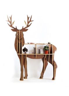 a wooden desk with a deer head on it's back and shelves for books