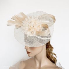 Elegant Ivory Kentucky derby hat for woman. This cream fascinate hat is embellished with a big bow. It is a perfect hat for weddings, Royal Ascot horse races, cocktails, derby... It is mounted on a headband. If you want, you can choose the side of the head were you like to wear the fascinator, just convo me. Any color of the fascinator can be changed to order. ** PROCESSING TIME: 5 -7 business days. ** DELIVERY TIME (DHL Express): 2-4 business days to EEUU, 1-2 to Europe and 3-5 to Australia. Fo Evening Mini Hat In Cream With Short Brim, Cream Evening Mini Hat With Short Brim, Formal Cream Headpiece With Short Brim, Cream Wedding Fascinator Hat, Beige Evening Fascinator Hat, Elegant Cream Hat Headpiece, Adjustable Cream Cloche Fascinator, Elegant Beige Mini Hat For Wedding, Beige Short Brim Headpiece For Evening