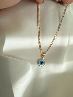 A dainty, modern evil eye necklace crafted to perfection. Made up of 18K gold filled, shimmering white crystals- this necklace has a powerful meaning. Perfect for layering, or wearing on its own, this evil eye necklace will protect you from all.  #Gold #fashion #Jewelry #Necklace #Pendant Do not wear it to the pool, spa, or the beach. - Remove when sleeping or exercising. - Avoid contact with perfumes, body oils and other chemicals, including household cleaners. - Do not use chemical jewelry cle Modern Evil Eye, Gold Fashion Jewelry, Red Evil Eye, Protection Jewelry, Evil Eye Protection, Protection Amulet, Body Oils, White Crystals, Protection Necklace