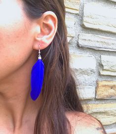 These are boho feather earrings in a rich royal blue color. They're perfect for everyday wear, and they add a nice little pop of color. The feathers are real and very lightweight, and they measure approximately 7 cm long and 2 cm wide. With the earring hooks, they measure approximately 8cm in total length. The hooks are a silver alloy that is nickel-free, and these come in a little jewelry box - all ready for gifting! These earrings are handmade with care. This item will ship in 1 business day. Elegant Blue Feather Earrings, Blue Feather Dangle Earrings, Adjustable Blue Feather Earrings, Blue Feather Earrings For Gift, Blue Feather Earrings Gift, Blue Feather Earrings As Gift, Silver Chain Earrings, Cobalt Blue Earrings, Round Dangle Earrings