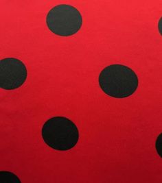 a red and black polka dot print fabric