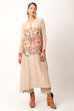 Beige kurta with abstract patch, zari work sleeve borders, multi color floral thread and bead embroidery. Paired with straight fit pant.
Components: 2
Pattern: Embroidered and Printed
Type Of Work: Applique, Thread and Zari Work
Neckline: Notched Round Neck
Sleeve Type: Full Sleeves
Fabric: Silk Chanderi, Cotton Slub
Color: Beige
Other Details: 
Side slits on kurta
Length:
Kurta: 48 inches
Pant: 35 inches
Note: The dupatta worn by the model is not for sale
Occasion: Puja,Mehendi and Haldi - Aza Multicolor Embroidered Long Sleeve Palazzo Set For Eid, Long Sleeve Palazzo Set With Intricate Embroidery For Festivals, Embroidered Long Sleeve Palazzo Set For Diwali, Bohemian Palazzo Set With Zari Work, Multicolor Embroidered Chanderi Sets With Long Sleeves, Chanderi Sets With Multicolor Embroidery And Long Sleeves, Chanderi Long Sleeve Sets With Multicolor Embroidery, Spring Palazzo Set With Zari Work And Straight Kurta, Chanderi Kurta With Embroidered Long Sleeves