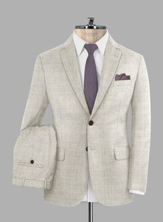 You can't go wrong with a neutral color palette, and our Italian Aime Ivory Gray Wool Suit ticks all the boxes. Made with super 120s merino wool, which will keep you warm in winter and cool in summer, it showcases an ivory gray colorway with a decent solid weave, making it a perfect match for both high-end elegance and practical purposes. This suit will be your new go-to for all occasions. 
 
 Look features a 2 button jacket with notch lapels, f aux horn brown    buttons, single vent, two cuff b Grey Wool Suit, Solid Texture, Button Jacket, Gray Suit, Wool Suit, Warm Grey, Neutral Colour Palette, Jacket Buttons, Black Button