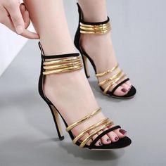 Gold Ankle Strap Sandals For Night Out, Chic Gold Heels With Metal Feet, Trendy Gold Heels For Evening, Trendy Gold Evening Heels, Gold Open Heel Sandals For Night Out, Luxury Gold Sandals For Night Out, Luxury Gold Sandals For Party, Trendy Gold Party Sandals, Gold Heels With Metal Feet For Summer