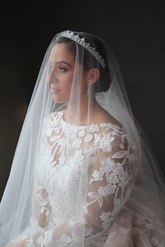 a woman in a wedding dress and veil