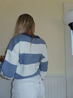 A cropped striped beige and blue sweater typically features a shorter length that hits above the waist or at the midriff. It is designed with horizontal stripes in a combination of beige and blue colors. The stripes may vary in thickness, with some sweaters having thin stripes and others having thicker ones. The sweater is usually made from a soft and comfortable fabric, such as cotton or a blend of materials. It has a crew neckline, with long sleeves Overall, a cropped striped beige and blue sw Striped Sweaters For Women, Striped Sweaters, Beige And Blue, Horizontal Stripes, Blue Sweater, Striped Sweater, Blue Sweaters, Stripe Sweater, High Waist Jeans