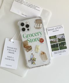 an iphone case with grocery store stickers attached to it next to some other items