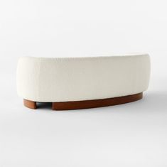 a white bench with wooden legs on a white background