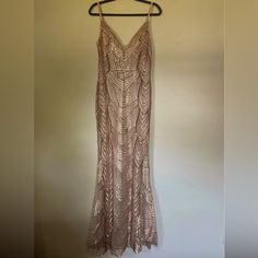 a dress hanging up on a hanger