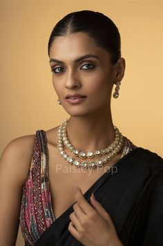 An elegant and classic polki necklace set is the design that offers delicate hints of traditional legacies and Victorian art forms of zirconia setting to bejewel your neckline. Embedded with uncut Polkis this beauty is designed and handcrafted by artisans of India with traditional jewelry-making techniques. Embellish your appearance with our Polki-inspired necklace that has a resemblance to Sabyasachi jewelry. Add this charm of Indian Jewelry to your wardrobe and see the heads turn. A perfect enchanting piece of jewelry that is both dramatic and elegant is here to assist you on your special days.  Necklace Closure - Adjustable Dori Earrings Closure - Push Back  Style Tip - Being a strong supporter of the intersection of classic and contemporary, we love designs that are contemporary yet bo Polki Necklace Set, Sabyasachi Jewelry, Necklace Closure, Sabyasachi Jewellery, Polki Earrings, Earrings Double, Indo Western Dress, Polki Necklace, Chocker Necklace