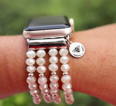 PLEASE read ENTIRE listing BEFORE purchasing These gorgeous custom watch bands are the perfect arm candy for your Apple Watch! Choose your color scheme and you're ready to rock your arm stack, watch in tow! Note: *These bands fit 38mm and 40mm Apple Watch faces ONLY and are ONE SIZE to fit an average-large sized wrist. I do not offer custom sizes, so please be sure that this band will work for you prior to purchasing. *Stretching the band over the user's hand is not recommended as this could bre Adjustable Apple Watch Band With Extender As Gift, Personalized Adjustable Apple Watch Band As Gift, Personalized Adjustable Apple Watch Band For Gift, Personalized Adjustable Apple Watch Band Gift, Adjustable White Watch Accessories For Gifts, White Adjustable Watch Accessories For Gift, Personalized Apple Watch Band Gift, White Personalized Watch Bands As Gift, Personalized White Watch Bands For Gift