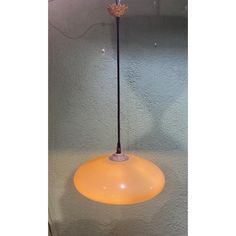 a lamp that is on top of a table with a light in the middle of it