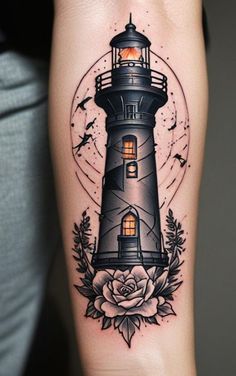 a tattoo with a lighthouse and flowers on the arm, in front of a full moon