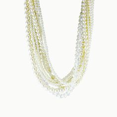 A glistening iridescence is the highlight of this one-of-a-kind, can't-miss multi-layered necklace. Satin ribbons, clear crystals, and white pearls in graduating sizes combine for a sartorial showstopper. Use the smooth ribbons to freshly fashion a short, medium, or long layered look - sophisticated and feminine - perfect for that special evening out! Fresh Water Cultured Pearls Pearl: Love - Beauty - Wealth Colors: Dove, Peach and Ivory Metal: Sterling Silver Length: 18" - 32" Adjustable Pearl White Multi-strand Pearl Necklace, White Multi-strand Pearl Necklace For Formal Occasions, Pearl White Multi-strand Beaded Necklace, Multi-strand Pearl White Pearl Necklace For Party, White Pearl Necklaces For Party, Multi-strand Pearl Chain Necklace For Party, Party Pearl Multi-strand Beaded Necklace, Multi-strand Pearl Drop Necklaces For Party, White Multi-strand Beaded Necklace With Pearl Drop