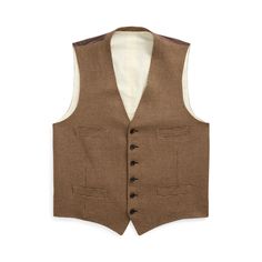 This vest is hand-tailored in Italy from a luxuriously lightweight cloth that was custom-developed for Ralph Lauren with Ireland’s Magee 1866. Its iconic houndstooth pattern is rendered using a blend of fine wool mulberry silk and cashmere. Classic Fitted Ralph Lauren Tweed Jacket, Sleeveless Tailoring Vest With Welt Pockets, Fitted Herringbone Vest For Fall, Fitted Ralph Lauren Tweed Jacket For Formal Occasions, Formal Fitted Ralph Lauren Tweed Jacket, Ralph Lauren Fitted Tweed Jacket For Formal Occasions, Fitted Tweed Vest For Work, Vintage Tweed Vest For Work, Classic Tailored Vest For Fall