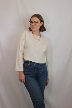 Everyday and simple cream ribbed knit top with long sleeves, cropped fit, and front pocket details details & fit: fits true to size. 64% cotton, 30% polyester, 6% spandex measurements: small: bust 36"/ waist 36"/ length 17.5" medium: bust 38"/ waist 38"/ length 18" large: bust 40"/ waist 40"/ length 18.5" model details: model is 5'7" and wearing size small Beige Long Sleeve Cotton Crop Top, Everyday Long Sleeve Cropped Sweater For Spring, Everyday Cotton Crop Top For Fall, Everyday Fall Cotton Crop Top, Trendy Long Sleeve Tops With Side Pockets, Long Sleeve Ribbed Cotton Crop Top, Cream Cropped Crop Top For Fall, Beige Long Sleeve Crop Top For Fall, Everyday Long Sleeve Crop Top For Fall