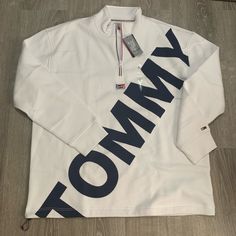 New And Never Used Tommy Hilfiger Denim Line White With Big Tommy Writing White Fleece Half-zip Top, White Fleece Top For Fall, White Half-zip Sweatshirt For Spring, Trendy White Half-zip Top, White Cotton Half-zip Outerwear, Casual White Half-zip Sweatshirt, White Fleece Outerwear With Letter Print, White Half-zip Sporty Sweatshirt, White Sporty Half-zip Sweatshirt