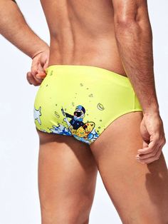 Make a splash and express your fun-liking personality with our Cartoon Graphic Swim Brief. Designed for adventurous people, these swim briefs feature vibrant and playful cartoon graphics that bring your swimwear to life. The elastic waistband ensures a snug fit, while the quick-drying fabric keeps you comfortable in and out of the water. Features: Pattern Type: Cartoon Fabric: Medium Stretch Material: Fabric Composition: 82% Polyester, 18% Elastane Size Chart ( Inches ): Size Length Waist Size S Casual Summer Swimwear With Character Print, Playful Graphic Print Swimwear, Playful Swimwear For Surfing Beach Season, Multicolor Swimwear With Character Print For Summer, Playful Sports Bottoms For Beach Season, Multicolor Character Print Swimwear For Summer, Playful Character Print Swimwear, Cartoon Print Swimwear For Summer, Summer Cartoon Print Swimwear