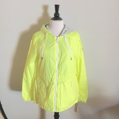 Bcbgeneration Neon Green Jacket Size M. A Lightweight Jacket Will Keep You Feeling Snugly Warm During The Holiday Season While Keeping You Looking Chic. Manufacture Describes The Color Neon Green But The Color Looks Like Neon Yellow. Drawstring Hood Front Zip Closure -2 Front Welt Zipper Pockets Interior Drawstring Waist Fishtail Hem Approx Measurements Armpit To Armpit 19" Length 26.5" Sleeve Length 25.5" Happy To Answer Any Questions. Thanks For Visiting My Closet. :) Sporty Hooded Spring Outerwear, Trendy Yellow Spring Windbreaker, Neon Green Jacket, Green Jacket, Neon Yellow, Lightweight Jacket, Neon Green, Drawstring Waist, The Holiday