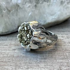 Sterling silver pyrite ring, Flower ring, raw stone ring, Druzy crystal ring, gifts for women, made in Armenia All our jewelry is made of high-quality sterling silver and is stamped with a 925 stamp 【FULL DETAILS】 ► Gemstone: natural pyrite ► RING SIZE: all size available ► RING WEIGHT: approx. 15 gr (0.033 lb0 ⦿ Attention: The color of the stones may differ due to a difference between monitors ◦* ◦* ◦* ◦* ◦* ◦* ◦* ◦* ◦* ◦* ◦* ◦* ✔️ Please, view my store policies before buying this item here. ht Unique Silver Cluster Ring For Promise, Unique Silver Cluster Promise Ring, Silver Rings With Raw Stone For Spiritual Style, Silver Crystal Ring With Raw Stone, Silver Rings With Raw Stone, Spiritual Silver Rings With Raw Stone, Silver Round Crystal Ring With Raw Stone, Sterling Silver Rings With Raw Stone, Silver Rings With Raw Stone For Promise