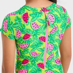 Update your child's swim wardrobe for the pool or beach with this Tropical Melon Fruit Printed One-Piece Rash Guard Swimsuit from Cat & Jack™. This cap-sleeve swimsuit features a pink melon print on a green palm leaf backdrop for a tropical vibe. Made from stretchy fabric for comfy movement in and out of the water, this rashguard swimsuit boasts a UPF 50+ rated construction that helps keep your kid shielded from the sun's UV rays. Plus, it's designed with a half-length back zipper for easy wear. Playful Fitted Tankini With Uv Protection, Playful Stretch Swimwear With Uv Protection, Playful Stretch Swimwear With Upf 50+, Stretch Short Sleeve Swimwear For Pool, Playful Fitted Swimwear With Uv Protection, Summer Beachwear Tankini For Playwear, Fitted Summer Playwear Tankini, Summer Sleeveless Tankini For Play, Stretch Tankini For Beach Playwear