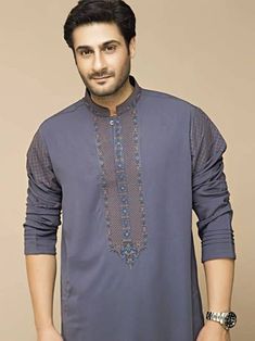 <ul> <li>Color: Light slate gray</li> <li>Prominent-looking kurta features embroidery detail on collar, sleeves, around placket and placket</li> <li>Complemented with matching shalwar</li> </ul> <p><br /><br /><strong>Additional Accessories:</strong><br />Peshawari Sandal: <strong>US$50</strong><br />Men's Shawl: <strong>US$50</strong></p> Casual Embroidered Lawn Suit For Eid, Cotton Lawn Suit With Embroidered Border And Long Sleeves, Traditional Gray Kurta For Eid, Gray Traditional Wear For Eid, Long Sleeve Cotton Lawn Suit With Embroidered Border, Traditional Gray Wear For Eid, Festive Unstitched Gray Kurta, Festive Long Sleeve Gray Kurta, Festive Lawn Suit With Embroidered Long Sleeves