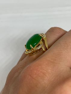 Vintage Lucky Green Nephrite Jade ring Large green nephrite jade Ornate gold finished White bronze Vintage ring, does not tarnish, NOT sterling Size 6, 6.5 or 8.5 My jeweler can custom re size for a $10-$20 fee All rings are shipped free in the US in a nice gift box. Check out our over a THOUSAND great reviews Engraving is $4 per letter and is not always perfect depending on the piece. It can take a few days if the jeweler is busy. This is payable to Paypal Judithsltd@gmail.com Yellow Gold Jade Cabochon Ring, Yellow Gold Jade Ring With Gemstone, Gold Jade Ring With Polished Finish, Gold Jade Cabochon Rings, Gold Rings With Jade Cabochon, Formal Gold Jade Rings, Gold Jade Emerald Ring, Fine Jewelry Gold Jade Rings, Gold Jade Rings In Fine Jewelry Style