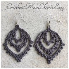 the crocheted earrings are made from yarn and have circular designs on each side