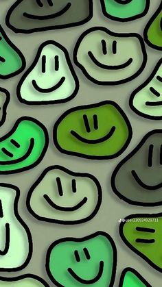 green and white smiley faces are shown in this artistic pattern on a wallpapered surface