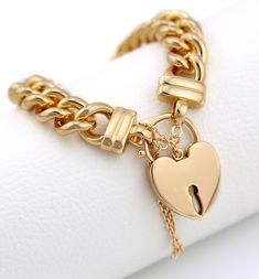 - Quantity: Price for ONE PIECE of BRACELET ONLY. - Heart Padlock Size: 29mm x 20mm - Bracelet Chain Width: 10MM                      - Bracelet Length: 19.5cm (Length is fixed, open or close the heart padlock to wear) - Material: Gold Filled Layer over brass, If you have allergic or sensitive skin, it's not suitable for you Gold Charm Bracelet Gift With Clasp, Valentine's Day Chain Bracelet Jewelry, Heart-shaped Jewelry Gift With Clasp, Lock Bracelet Jewelry Gift, Yellow Gold Heart Chain Bracelet For Valentine's Day, Valentine's Day Chain Bracelet With Lobster Clasp, Valentine's Day Gold Plated Heart Bracelet With Adjustable Chain, Heart-shaped Jewelry With Clasp For Gifts, Gold Plated Heart-shaped Chain Bracelet With Adjustable Chain