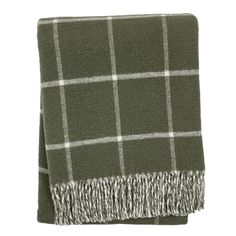 a green and white plaid blanket with fringes