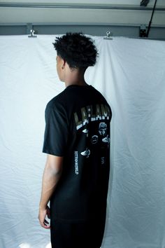 Travis Scott Graphic tee in Black, Regular Fit. Sports T-shirt With Back Print And Crew Neck, Relaxed Fit Sports T-shirt With Text Print, Streetwear T-shirt With Back Print And Short Sleeves, Short Sleeve T-shirt With Back Print For Streetwear, Sporty Graphic Print T-shirt For Streetwear, Urban T-shirt With Text Print And Crew Neck, Urban Streetwear T-shirt With Back Print, Urban Style T-shirt With Back Print And Relaxed Fit, Hip Hop Streetwear Crew Neck Tops