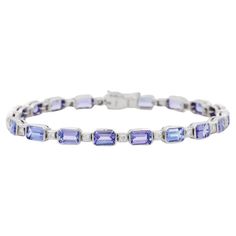 Tanzanite and Diamond bracelet in 18K Gold. It has a perfect octagon cut gemstone to make you stand out on any occasion or an event. A tennis bracelet is an essential piece of jewelry when it comes to your wedding day. The sleek and elegant style complements the attire beautifully, whether it's the bride wearing it herself, or as a gift to her bridesmaids to wear on the D’day. Bracelets are worn to enhance the look. Women love to look good. It is common to see a woman rocking a lovely gold brace Luxury Blue Tennis Bracelet For Wedding, Gold Braces, Tanzanite Bracelet, Tanzanite Stone, Tanzanite Diamond, Tennis Bracelet Diamond, D Day, Diamond Sizes, Tennis Bracelet