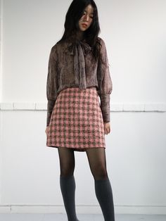 Editor's Notes The mini tweed wool skirt is made with a mix of multi colors and have a semi A-line silhouette. - Wearable length with a perfect fit- Clean design at the front- Twill lining for a comfortable fit- Concealed zipper at the back- Recommended size 55-66Measurements(in.)S / M- Length: 16.14 in. / 16.73 in.- Waist: 13.39 in. / 14.17 in.- Hip: 18.7 in. / 18.9 in.*There may be 0.39 - 0.79 in. of error depending on the way of measuringModel info: Height 5' 5.5'', Bust 30.5 in., W Winter Pink Tweed Dress, Pink Tweed Dress For Winter, Tweed Mini Skirt For Fall Workwear, Fall Tweed Mini Skirt For Work, Chic Tweed Mini Skirt For Fall, Elegant Pink Mini Skirt For Fall, Fall Pink Pleated Skirt, Chic Pink Tweed Skirt, Fall Lined Pink Mini Skirt