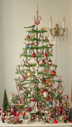 a small christmas tree with ornaments on it