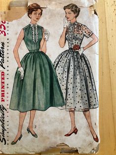 two women's dresses are shown on a piece of paper