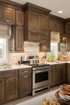 a kitchen with wooden cabinets and stainless steel appliances