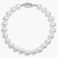 Classically luminous, this Freshwater cultured pearl bracelet features nearly-round white pearls strung on a hand-knotted 6.5" silk blend cord. A polished 14k white gold safety clasp secures the look. Elegant Adjustable Single Strand Pearl Bracelet, Elegant Hand-strung Pearl White Bracelet, Formal Adjustable Single Strand Pearl Bracelet, Silver Single Strand Pearl Bracelet, Elegant Round Pearl Bracelet With Sterling Silver Clasp, Elegant Formal Beaded Bracelets With Sterling Silver Clasp, Classic White Bracelets With Sterling Silver Clasp, Elegant Adjustable Hand-strung Pearl Necklace, Elegant Hand-strung Pearl Necklace