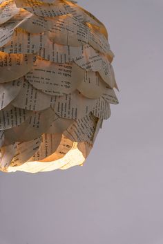 a light that is made out of old book pages