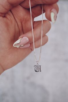 "Our custom Old English letter necklace seamlessly merges sophistication with a touch of rebellion. Tailored for individuality, it's a unique accessory that adds a personalized, on-trend flair to your style. - Model wearing 18\" Length. - DETAILS: ♦︎TINY 10mm Rhodium Plated Letters ♦︎925 Sterling Silver Materials & Finishes - ✌︎Custom orders: We're more then happy to customize our pieces. If you have any requests, message us so we can have a lil chat 💭. We really do appreciate your ideas just as you do ours. ------ ✘Disclosure: Keep in mind that all custom orders are non refundable." Old English E, Old English Letters, Letter Necklace Silver, English Jewelry, Dainty Initial Necklace, English Letter, Custom Name Necklace, Necklace Personalized, Letter Necklace