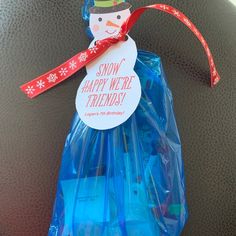 a snowman ornament is wrapped in plastic