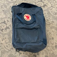 Never Used Blue Backpack. It’s Been Sitting In A Storage Bin And It’s Ready To Go To A New Home. Blue Backpack, Storage Bin, Kanken Backpack, Fjallraven Kanken, Fjallraven Kanken Backpack, Ready To Go, Storage Organization, New Home, Color Blue