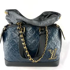 Extremely Limited Edition Bag From 2009-2010 Collection. Monogram Double Jeu Neo Alma - A Bag In A Bag. These Two Bags Can Be Used Together Or By Themselves. This Purse Is Made Of Navy Monogram Leather. The Handmade Knotted Handles Are Done In Flat Black Leather. This Bag Has A Lv Logo On The Front Left Side Of The Bag With Gold Studs. The Inside Of This Bag Comes With A Removeable Pochette Made From Jacquard Textile With Silver Metallic Threads. The Pochette Straps Are Gold Brass Chains With Bl Designer Monogram Canvas Satchel For Evening, Blue Shoulder Bag For Everyday Luxury, Luxury Blue Bags For Everyday, Blue Monogram Canvas Shoulder Bag With Branded Hardware, Blue Luxury Monogram Canvas Shoulder Bag, Blue Monogram Canvas Shoulder Bag With Top Handle, Blue Monogram Canvas Top Handle Shoulder Bag, Blue Monogram Canvas Bag With Detachable Handle, High-end Blue Evening Satchel