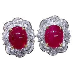 A pair of exquisite earrings feature a stunning design in Art Deco style, so delicate gems and brilliant diamonds. Crafted with refined details, the soft and feminine design adds a touch of elegance to any ensemble . The combination of the radiant red rubies and sparkling diamonds creates a dazzling and sophisticated look. Gorgeous earrings come in 18k gold with 2 pieces of Natural Burma Rubies, extra fine quality, spectacular color, in perfect oval/cabochon cut , of 11,00 carat, and 174 pieces of Natural Diamonds, in baguettes and round brilliant cut, of 3,60 carats, F color VS clarity, so bright diamonds. Handcrafted by artisan goldsmith. Excellent manufacture and quality of gems. Complete with AIG report. Whosale price. Note: no taxes on my shipment. Blink Blink, Radiant Red, 18k Gold Earrings, Oval Earring, Feminine Design, Ruby Diamond, Brilliant Diamond, Art Deco Style, Oval Cabochon