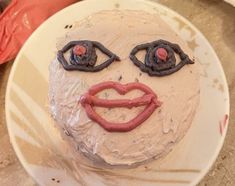 a cake that has been decorated to look like a face