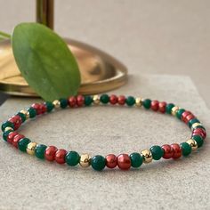 Christmas Seed Bead Bracelets This design bracelets are made of green agate, pearls and red agate stones.  When people think of the colors red and green, one thing comes to mind: Christmas.  Red has long been a powerful color associated with fire, spiritual awakening, and the blood of Jesus Christ, whose birthday is celebrated on December 25.  Green often symbolizes money, good luck, and health through the holidays and into the new year. ☆ Each of the pearls we use to create bracelets were forme Green 8mm Beads Bracelets As Gift, Elegant Beaded Bracelets For Holidays, Elegant Beaded Bracelet For Holidays, Elegant Beaded Holiday Bracelet, Festive Green Beaded Bracelets With Colorful Beads, Festive Christmas Bracelets With Round Beads, Festive Green Beaded Bracelets, Beaded Jewelry Christmas Gift, Beaded Jewelry For Christmas Gift