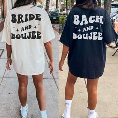 two women walking down the sidewalk wearing matching shirts and socks that read bride and bouge