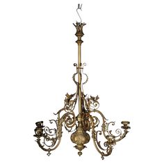 an ornate chandelier with five candles on it